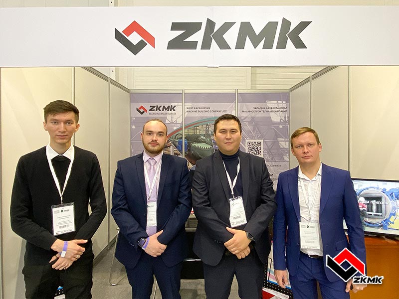Employees of the West Kazakhstan Machine Building Company communicate with visitors of the exhibition