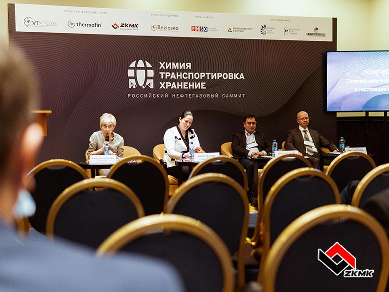 Employees of the West Kazakhstan Machine Building Company communicate with visitors of the exhibition